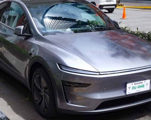 Front three-quarter view of a 2025 Tesla Model Y in Quicksilver at Tesla’s Flagship Store, Uptown BGC.