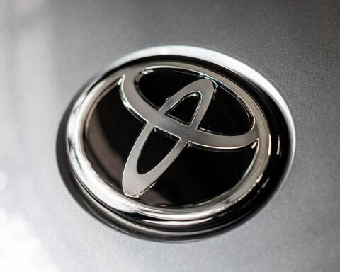 Close up of a silver Toyota emblem on the front of a vehicle