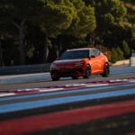 Audience view of the Genesis Magma presentation inside an event hall.