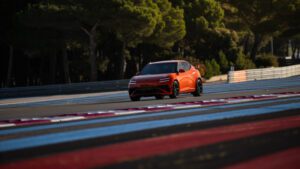 Audience view of the Genesis Magma presentation inside an event hall.