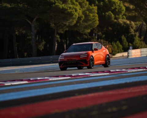 Audience view of the Genesis Magma presentation inside an event hall.