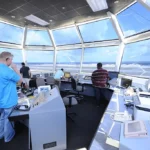 Pope Field air traffic control tower photographed from ground level; U.S. Air Force image by Tech. Sgt. Michael Holzworth, Public Domain.