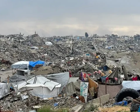 View of a heavily damaged street in central Gaza City showing collapsed façades and rubble-strewn pavement after February 2025 bombardment