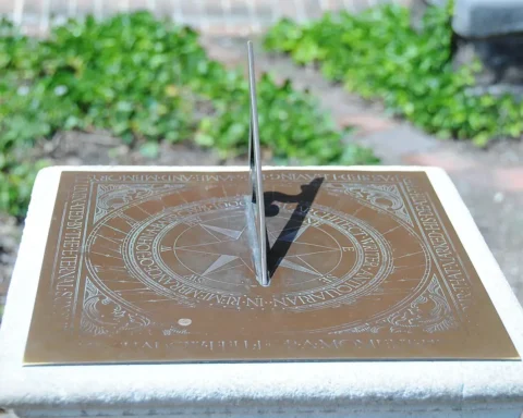 Close-up of a bronze horizontal sundial at Bruton Parish Church in Williamsburg, Virginia, used as the feature image for a daylight saving time explainer.