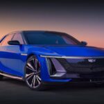 Cadillac Celestiq front three-quarter view near modern architecture at sunset