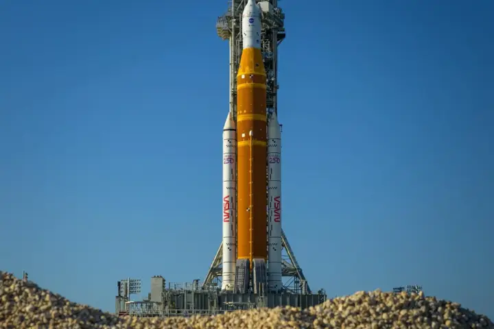 Artemis II Space Launch System rocket and Orion spacecraft on a mobile launcher at Launch Complex 39B at Kennedy Space Center.