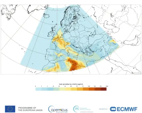 Forecast map from Copernicus CAMS showing Saharan dust plume moving from North Africa across Spain toward the UK with colour scale indicating dust concentration levels.