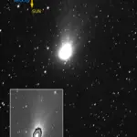 Image of interstellar comet 3I/ATLAS captured by ESA’s JUICE spacecraft JANUS camera on 6 November 2025 showing a bright coma, tail and jets, with arrows indicating the Sun’s direction and the comet’s velocity.