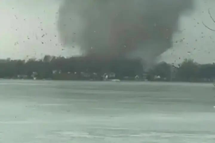 Large tornado funnel approaching Union Lake in Union City Michigan with debris and destroyed homes after severe storms on March 6 2026