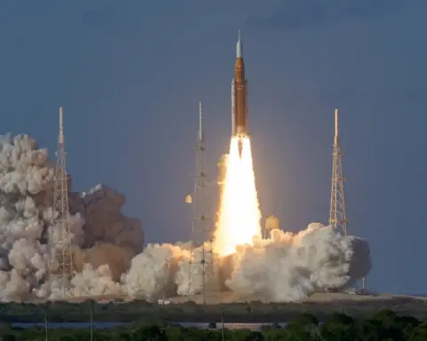 Artemis II Space Launch System rocket lifting off from Kennedy Space Center with the Orion spacecraft and crew aboard.