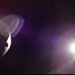 Artemis II Orion spacecraft observing a solar eclipse from behind the Moon, with the Sun’s corona visible in deep space