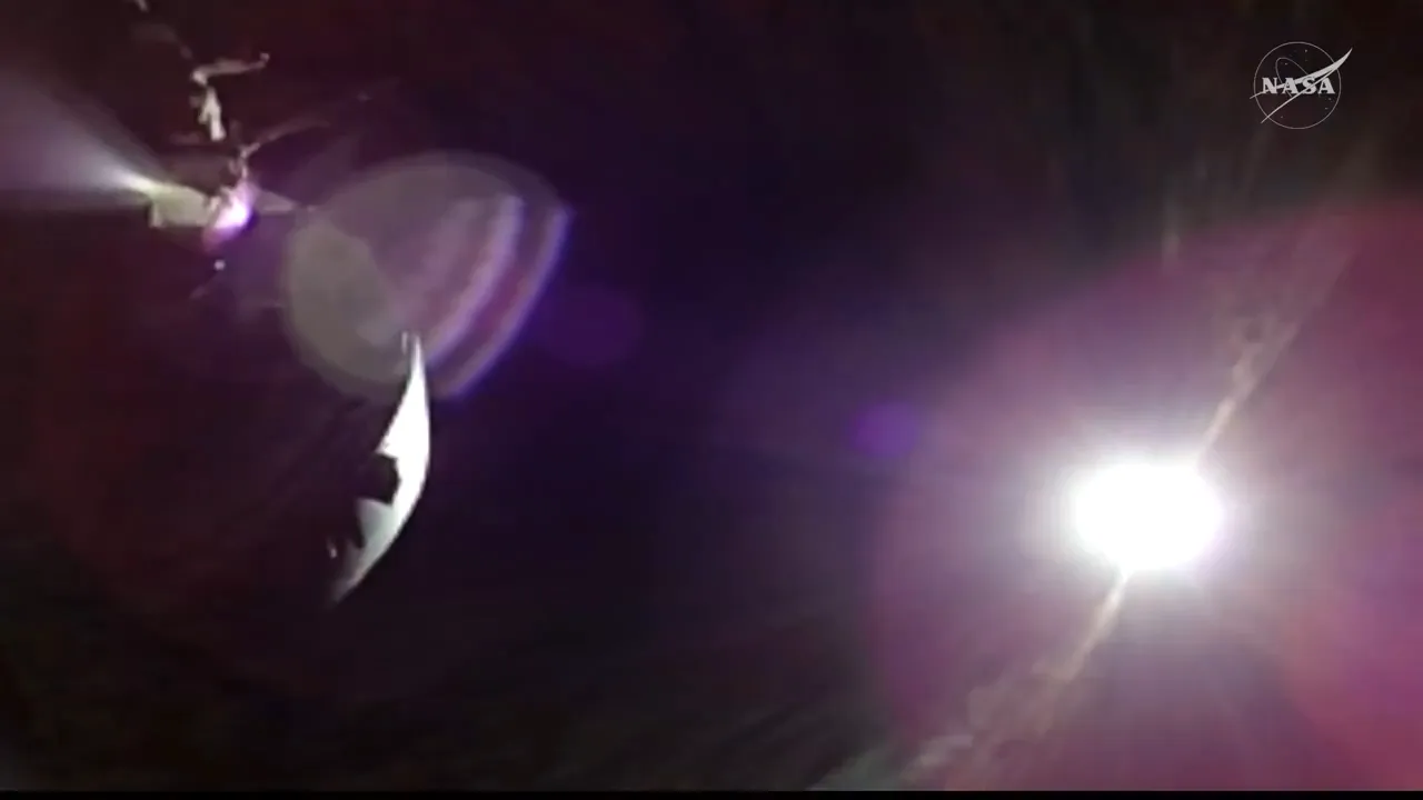 Artemis II Orion spacecraft observing a solar eclipse from behind the Moon, with the Sun's corona visible in deep space