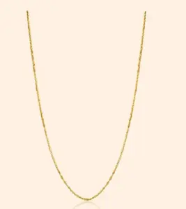 Delicate ladies' gold chain with a fine link pattern and polished gold finish displayed against a neutral background.