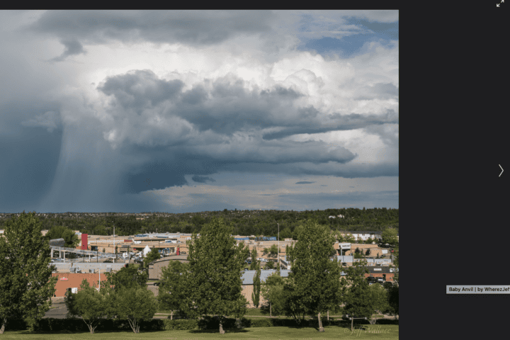Storm clouds and severe weather conditions near St. Albert, Alberta during high-temperature summer period