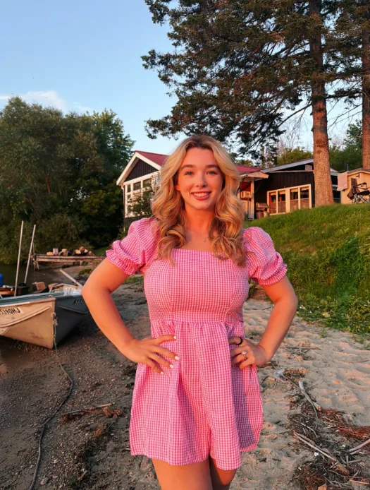 Portrait of Baylen Dupree smiling outdoors, illustrating her endometriosis awareness coverage.
