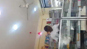 A pharmacist at work inside a pharmacy.