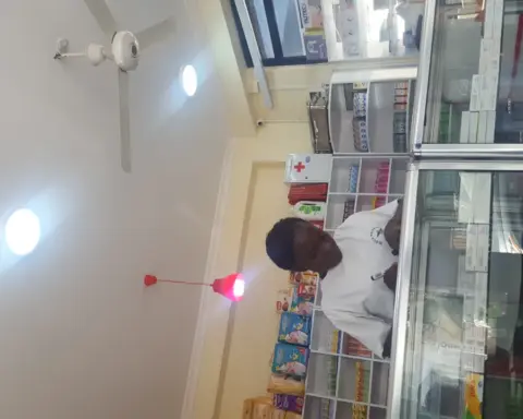 A pharmacist at work inside a pharmacy.