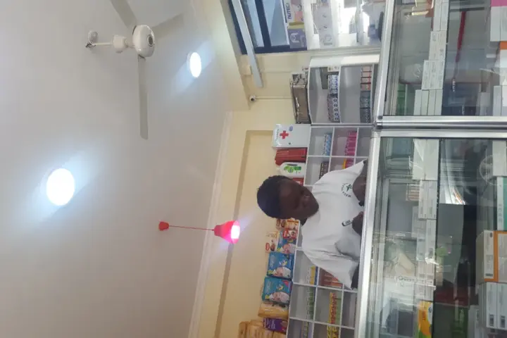 A pharmacist at work inside a pharmacy.