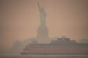 Wildfire smoke rising across the horizon.