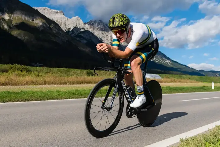 Road cyclist competing in a time trial event.