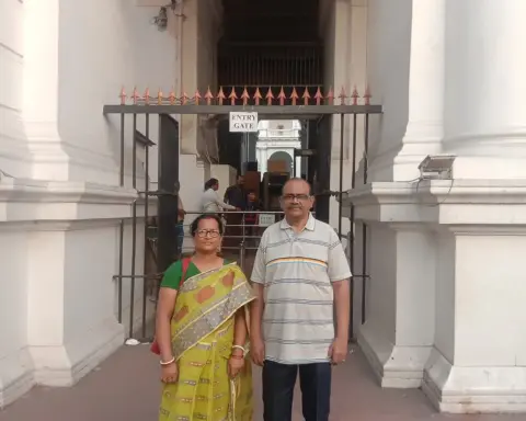 Elderly Indian couple standing outside a museum in Kolkata.