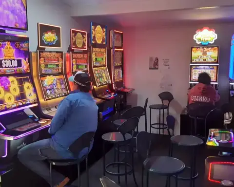 Rows of gaming slot machines inside a pokies room at an Australian hotel