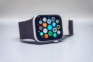 Close-up of black smartwatch displaying activity rings and fitness metrics