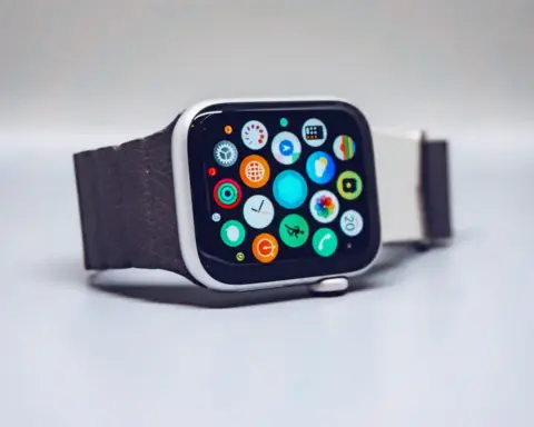 Close-up of black smartwatch displaying activity rings and fitness metrics