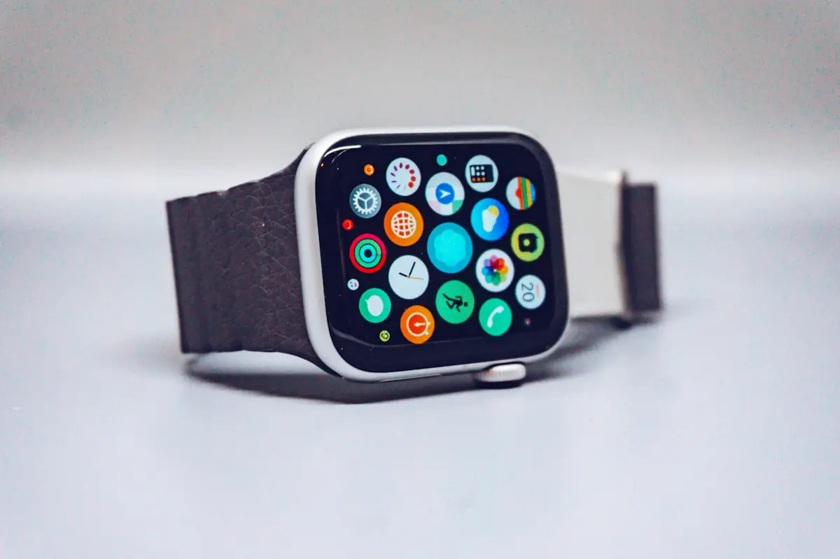 Close-up of black smartwatch displaying activity rings and fitness metrics
