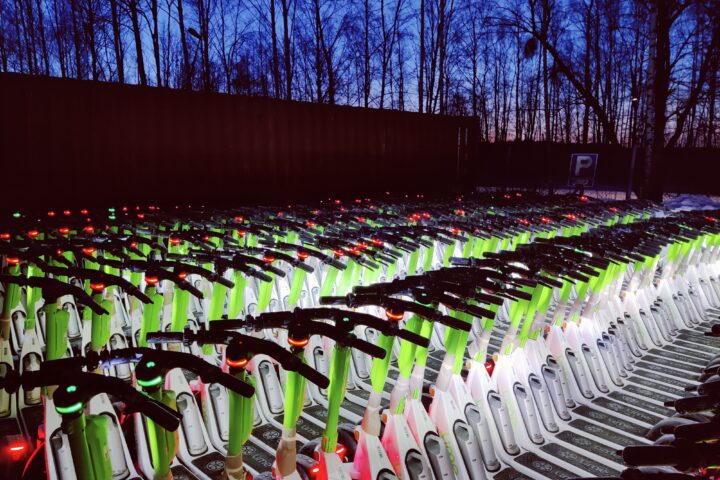 Row of shared e-scooters from the Lime company parked together