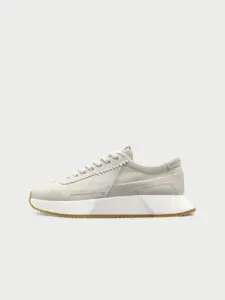 A compostable sneaker showcasing regenerative fashion design at a product awards event.