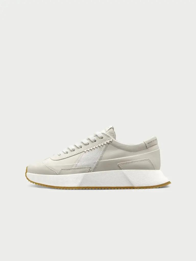 A compostable sneaker showcasing regenerative fashion design at a product awards event.
