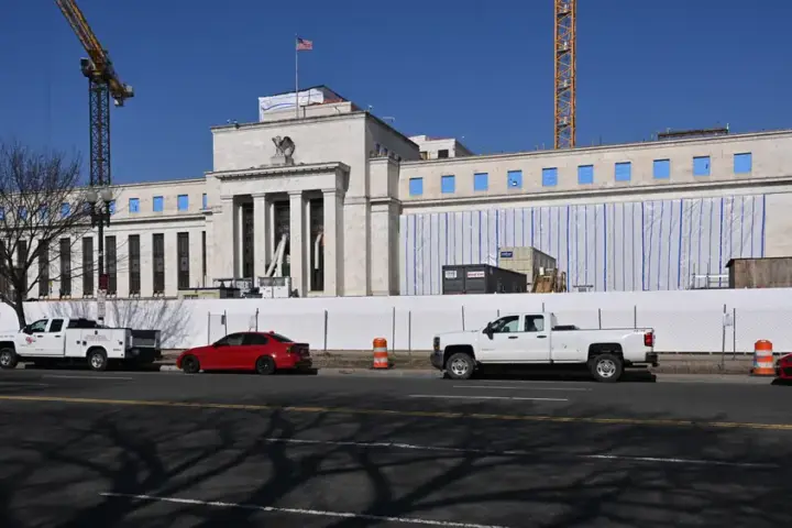 Eccles Federal Reserve Building in Washington DC photographed during 2025 construction work showing the neoclassical facade
