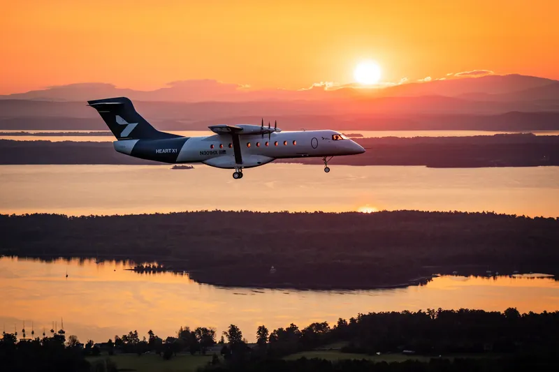 Heart Aerospace ES-30 electric aircraft in flight at sunset
