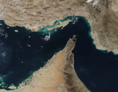 Strait of Hormuz satellite view showing narrow waterway between Iran and Oman