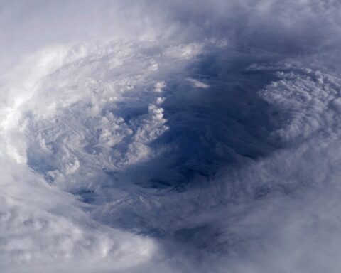 Aerial satellite view of Hurricane Isabel over the Atlantic Ocean, showing the storm's spiral cloud pattern and eye, illustrating tropical cyclone formation