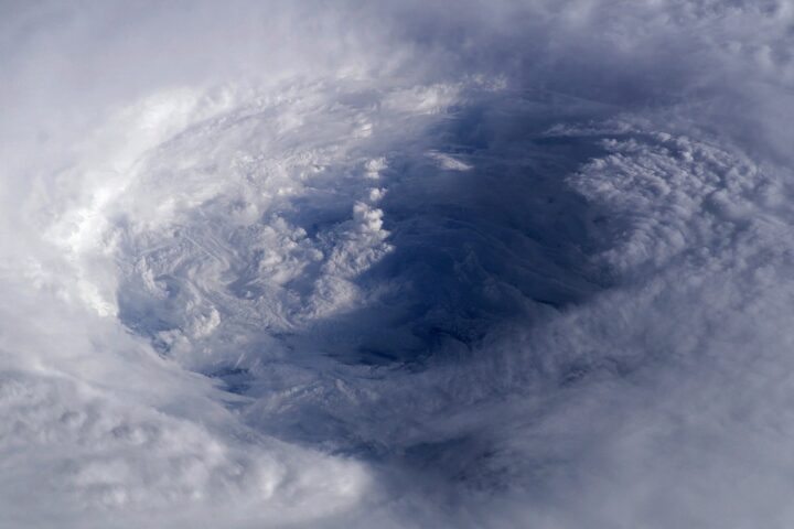 Aerial satellite view of Hurricane Isabel over the Atlantic Ocean, showing the storm's spiral cloud pattern and eye, illustrating tropical cyclone formation