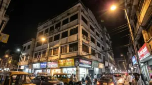 Multi-storey building on a Kolkata street at night