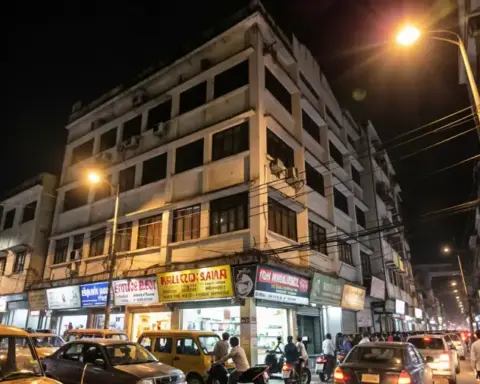 Multi-storey building on a Kolkata street at night