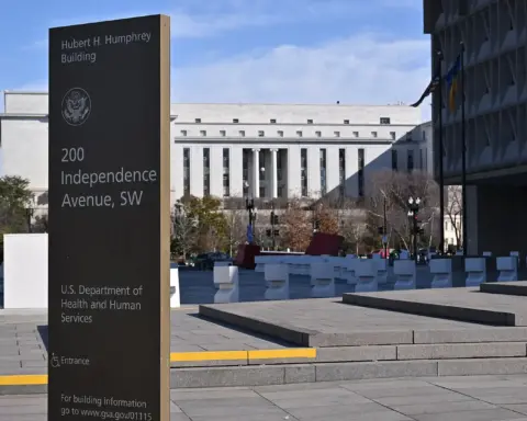 Freestanding dark sign in front of the Hubert H. Humphrey Building reading Hubert H. Humphrey Building, 200 Independence Avenue SW, U.S. Department of Health and Human Services, with the federal seal above