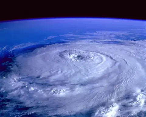 Satellite image of Tropical Storm Dolly swirling over the Atlantic with cloud bands spiraling around the center