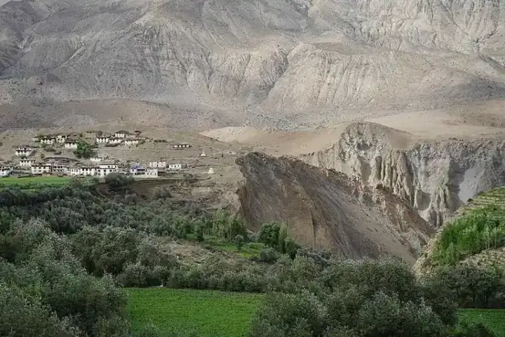 Himalayan village on steep slopes vulnerable to landslides and flash floods in mountain terrain