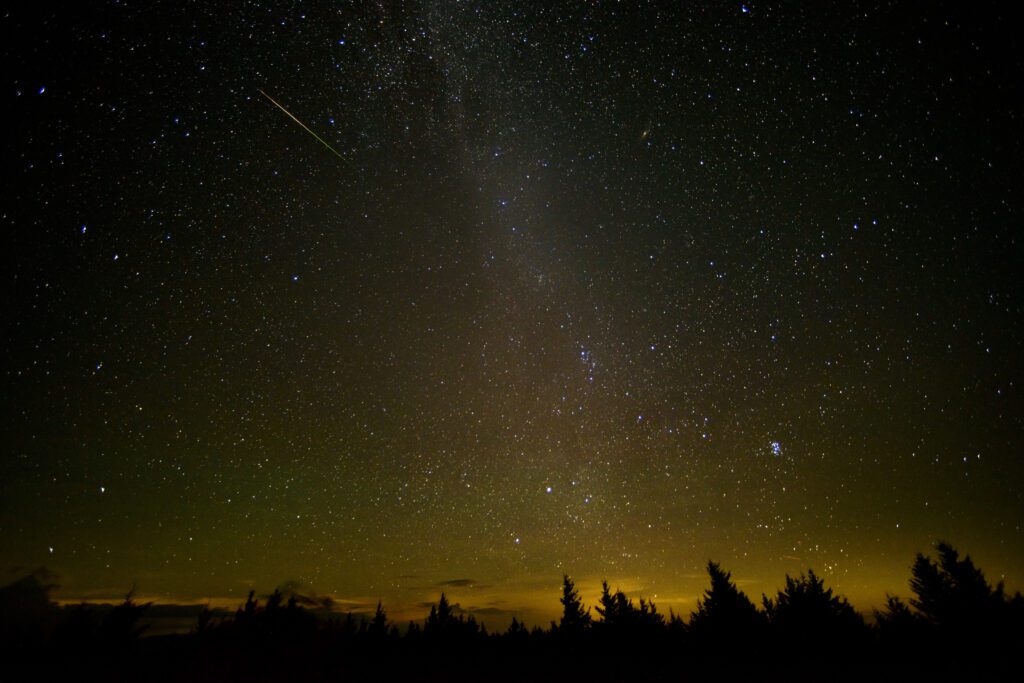 Perseids meteor shower peaks with up to 100 meteors per hour under rare new moon darkness; NASA streams live watch party