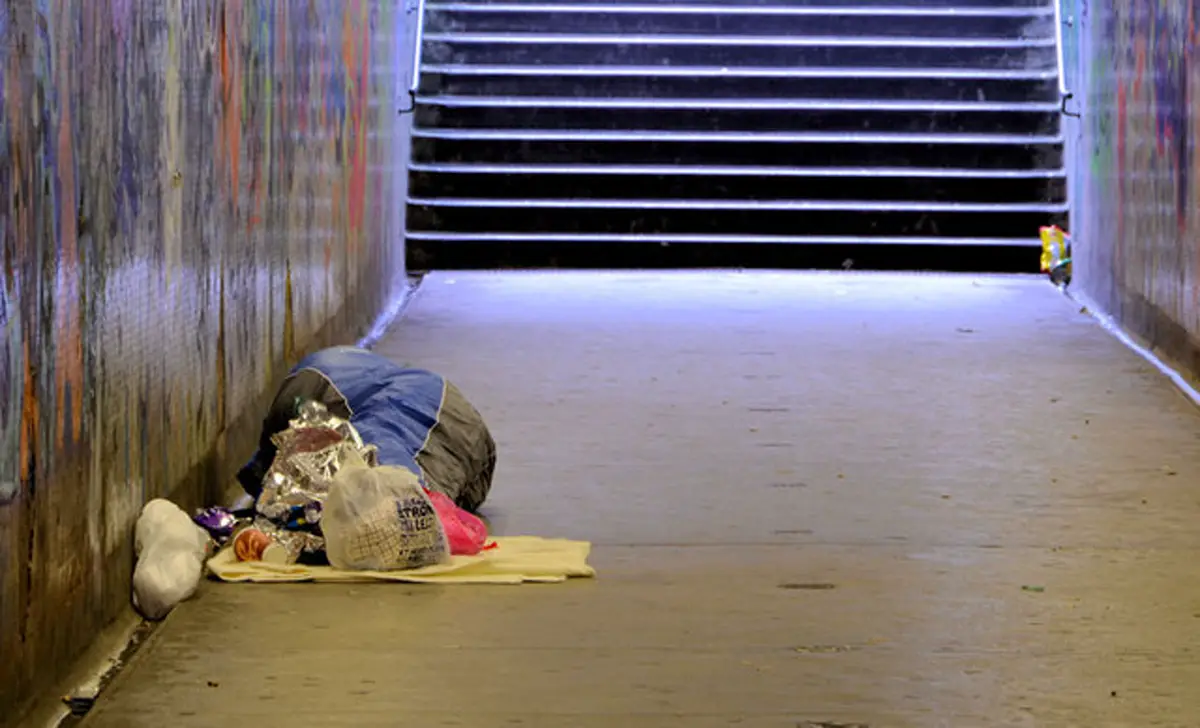 A person sleeping rough on a street in Belfast