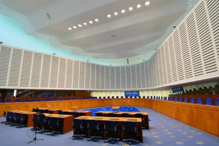 Federal courtroom interior with judge's bench and juror seats