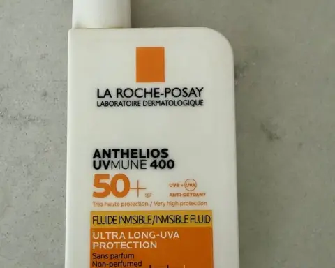 A white bottle of high-protection sunscreen with SPF 50+ label