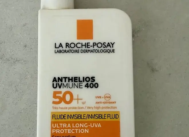 A white bottle of high-protection sunscreen with SPF 50+ label
