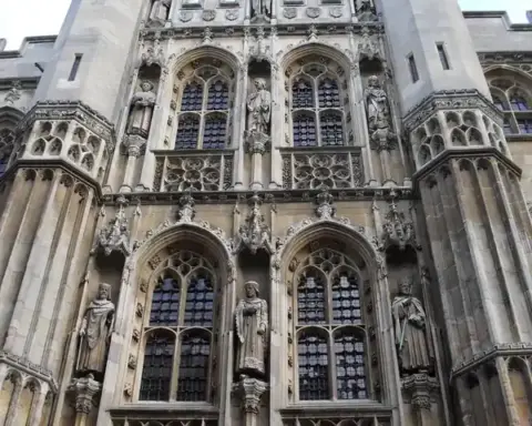 The historic Old Schools building complex at the University of Cambridge, with distinctive medieval stone architecture and arched windows