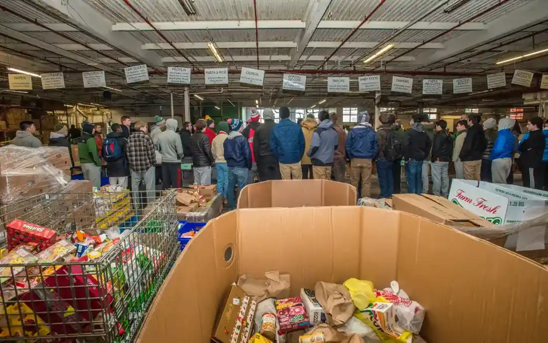 Volunteers sorting donated food at a community food bank.