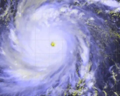 Satellite view of Super Typhoon Dolphin, a Category 5 storm with a well-defined eye churning over the western Pacific Ocean, with spiral rainbands extending outward - the same weather system that preceded Tropical Depression Peilou's record-breaking rainfall in Japan's Chiba Prefecture.